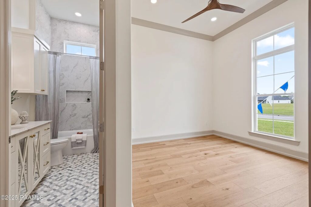 Legendary Contractors 2025 Parade of Homes, 201 Ivy Cottage, hall bathroom antique mirror cabinet glass by M&M Glass